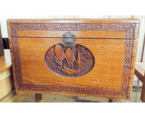 A small carved teak blanket chest with carved panels to the top, possibly used as a cella ret as has a zinc liner, together w