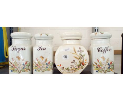 A ceramic tea, coffee, sugar jar, biscuit jar and three stoneware cider jars