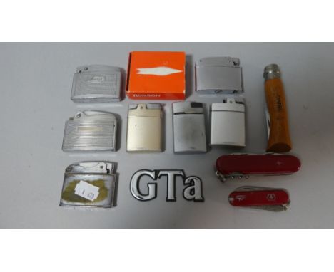 A Collection of Various Pocket Lighter and Pen Knives 