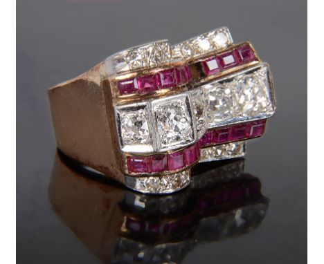 An Art Deco Diamond and Ruby Ring: Of stepped design in white and gold settings, comprising channel set baguette rubies and o