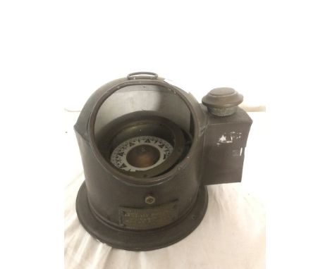 A lifeboat binnacle compass, marked No. 323, 1926, with the barometer in the form of an anchor