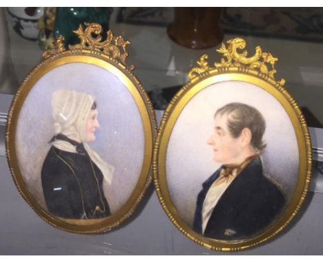 A pair of 19th century portrait miniatures depicting a lady &amp; gentleman