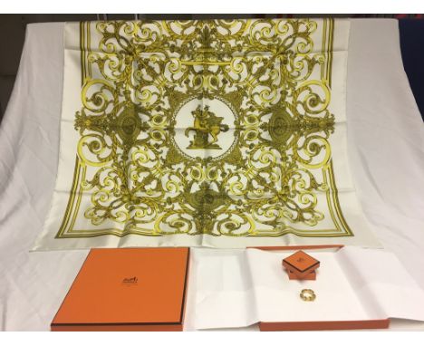 A boxed Hermes link scarf ring and "Les Tuileries" silk scarf