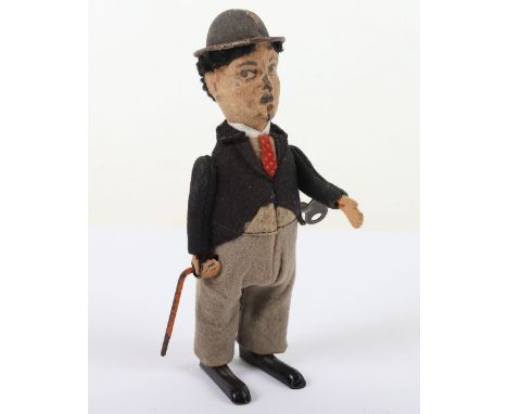 Schuco Charlie Chaplin Tinplate Clockwork Figure, circa 1930’s  felt covered tinplate body, working clockwork mechanism, revo