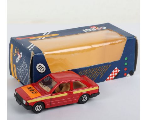 Corgi 600 Ford Escort BBC Promotional Model, red body, beige interior, BBC sticker to bonnet, yellow paper stripes to sides, 