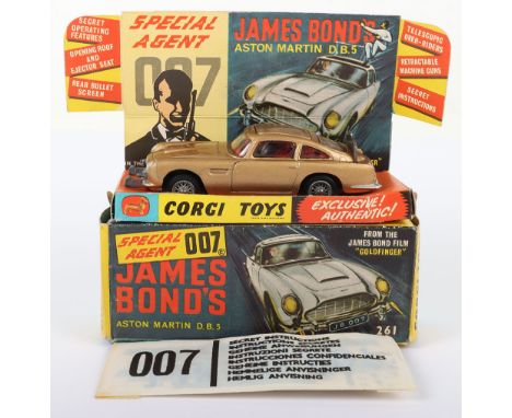 Corgi Toys 261 James Bond Aston Martin D.B.5 from the Film “Goldfinger” gold body, with working ejector seat, retractable mac