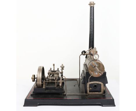 A large live steam twin cylinder steam plant, German circa 1912, horizontal copper boiler with chimney, weighted safety valve