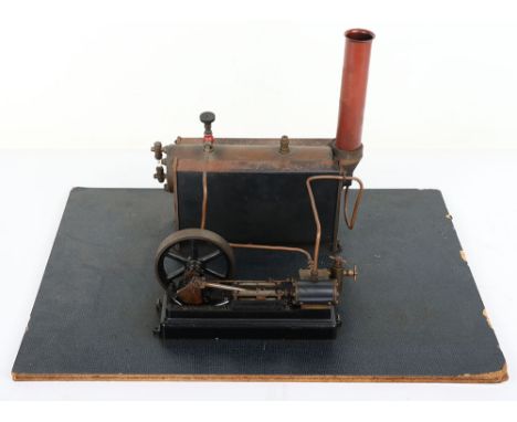 Small Stuart Turner single cylinder horizontal engine and boiler, engine with cast guides, cylinder with outlets, spoked flyw