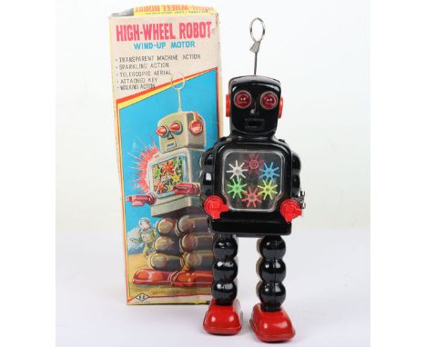 Boxed KO Yoshiya clockwork High-Wheel Robot, Japanese 1950s, black tinplate robot with red plastic pincers, transparent gear 