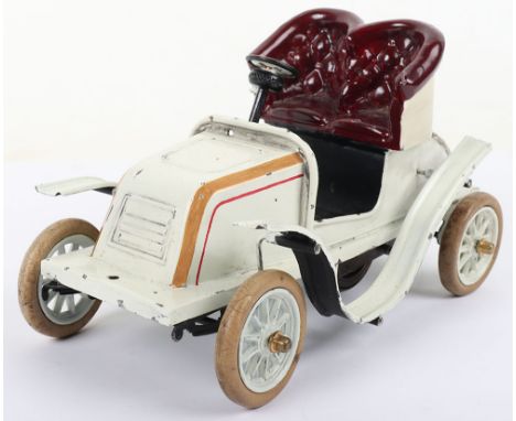 A good Bing tinplate clockwork ‘De Dion’ two seater runabout, German 1904, the cream hand enamelled painted car with red and 