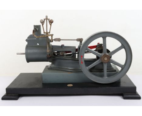 A cut-away demonstration model of a horizontal steam engine, single cylinder with piston in trunk guide, valve chest and ball