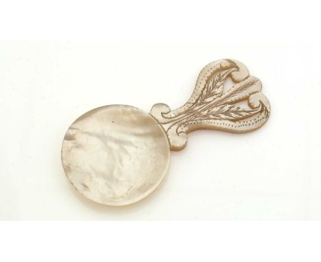 An early 19th Century mother-of-pearl caddy spoon, with a pierced and engraved stem, c.1800, 7cm long.