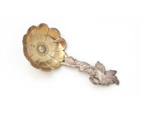 A Victorian silver caddy spoon, resembling an anemone flower with a foliate stem and gilt bowl, by Hilliard &amp; Thomason, B