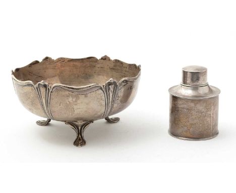 An Edwardian silver rose bowl, on three feet, with shaped and moulded decoration around the sides and rim, and a presentation