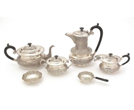 A 20th Century Indian silver four-piece tea service, with oval bodies, waisted necks and bead borders, chased around the side