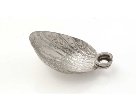 A George III silver caddy spoon, with a coiled wire handle and a chased and fluted, deep bowl, no apparent maker’s mark, Lond