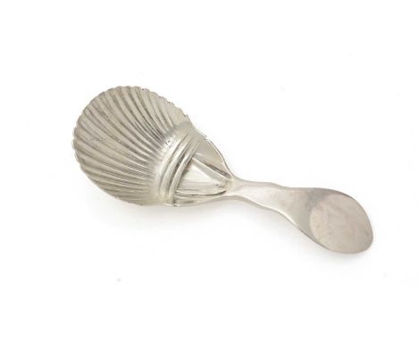 An early George IV Irish silver caddy spoon, with a part-fluted bowl and a pointed, swollen terminal, initialled "V.L" on the