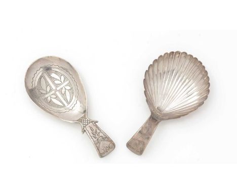 Two George III engraved silver caddy spoons, one with a fluted bowl, Birmingham 1806, and one with engraving in the bowl, Bir