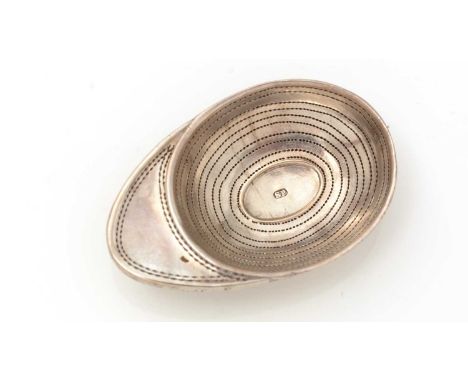 A George III silver “jockey cap” caddy spoon, with pricked concentric rings and pricked border work around the peak, maker’s 
