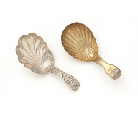 A George III silver-gilt caddy spoon, fiddle pattern with a fluted bowl, crested, by George Knight, London 1818; and another 