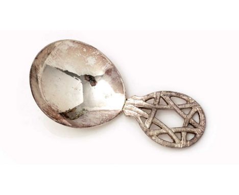 A George V silver hand-made caddy spoon,with a hammered bowl and an openwork handle with a geometric pattern, by A.E. Jones, 