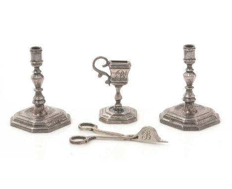 A rare mid 18th Century Dutch silver miniature or toy lighting suite: a pair of silver candlesticks, on canted square bases w