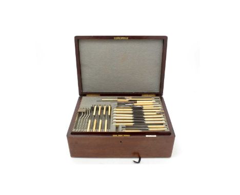 A George V silver canteen of flatware and cutlery, Hanovarian pattern, in a fitted box with lift-out trays to include: twelve