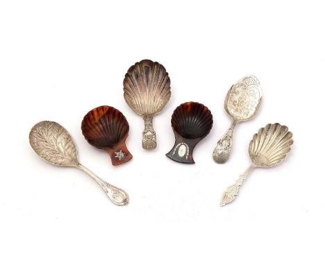 Two George III silver-inlaid tortoiseshell caddy spoons, with scallop shell bowls; a George IV chased silver caddy spoon; two