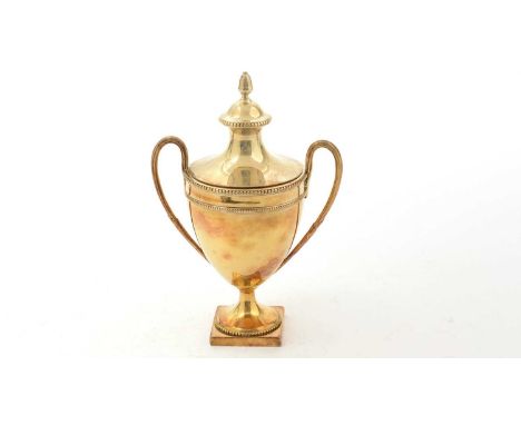 A George III silver gilt caddy or sugar vase, in the form of a classical urn with reeded loop handles, bead borders and a squ