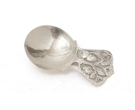 A George V silver arts and crafts caddy spoon, with a lug handle, pierced with a stylised apple tree, by Bernard Instone, Bir