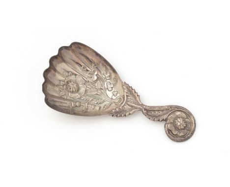 A Victorian silver caddy spoon, with a fluted, fan-shaped bowl, stamped with a rose, thistles and shamrock, with a flowerhead