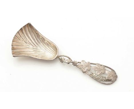 A Victorian silver caddy spoon, with a fluted shovel bowl an a tendril stem with applied leaves, maker’s mark partially mis-s