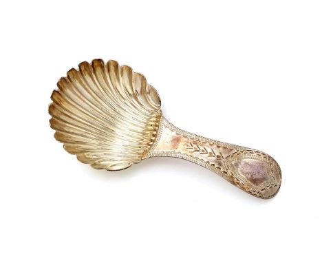 A George III silver caddy spoon with a bright-cut stem and a fluted circular bowl, by Hester Bateman, London 1788, 7.6cm long