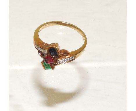 An 18ct gold ladies dress ring, set with a central square cut sapphire/ruby and emerald coloured stones.  Ring size L. 