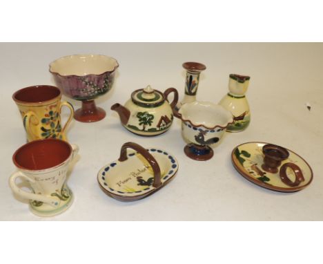 A Longpark Torquay pottery pedestal sugar bowl; a similar basket both with cockerell design; other Torquay motto ware pottery