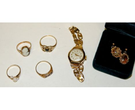 Four 9ct dress rings, 9ct gold cased wristwatch (strap is not gold) gold plated opal earrings