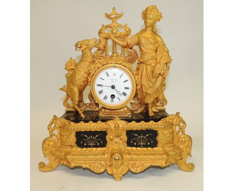 A 19th Century French gilt spelter mantel timepiece the white enamel dial inscribed "Rossiter Paris" and with black Roman num