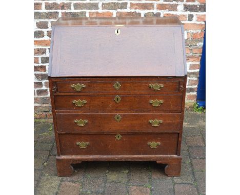 Georgian oak bureau on bracket feet