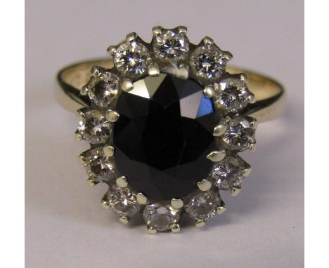 9ct gold sapphire and diamond cluster ring size K/L sapphire 2.4 ct diamond total 0.42 ct total weight 3.6 g