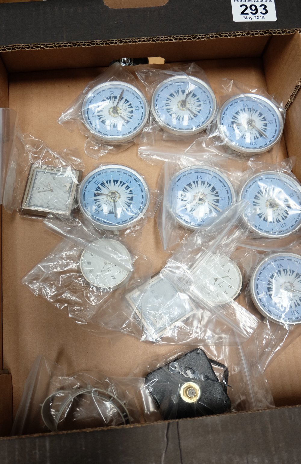 A collection of Wedgwood replacement clock faces/ movements (11)