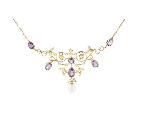 An Edwardian amethyst and seed pearl necklace  of open scrolling design, set throughout with seed pearls and oval and round c