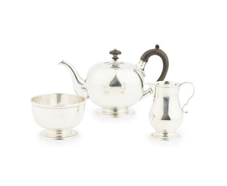 A three piece tea service  Goldsmiths &amp; Silversmiths Company, London 1921, comprising teapot, sugar basin and milk jug, a