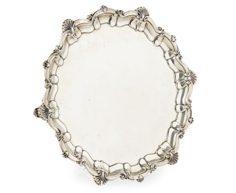 A large early twentieth century salver  Garrard &amp; Co Ltd, London 1925, of moulded circular form with raised cast shell bo