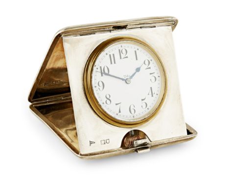 A silver cased travelling clock  Walker and Hall, London 1911, of square cushion form, hinged cover with engraved initials, e