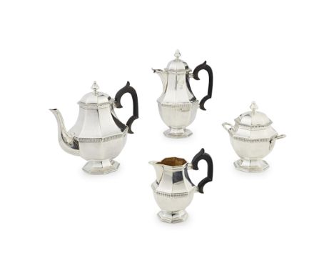 A French silver four-piece tea service  circa 1920, comprising teapot, water pot, twin handled sugar bowl with lid and a milk