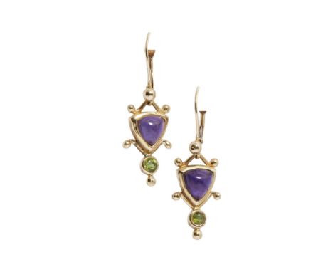 A pair of amethyst and peridot pendant earrings  each set with a triangular amethyst cabochon in a stylised surround, above a