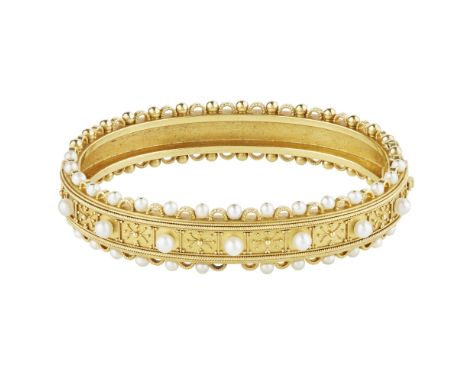 A Victorian pearl set bangle  of hinged design, the front half with beaded and wirework detail throughout, set with small pea