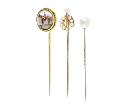 A collection of stick-pins  to include one set with an Essex crystal cabochon depicting a race horse and jockey; another set 