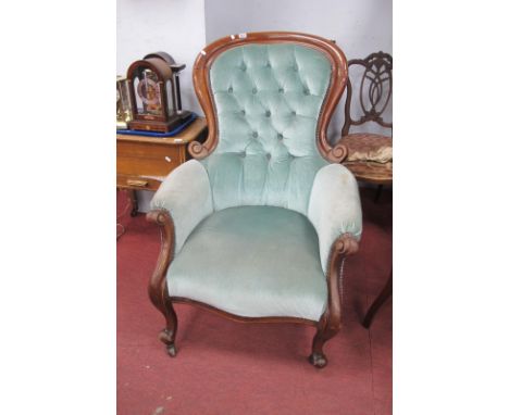 A XIX Century Mahogany Framed Arm Chair, with balloon back, scrolled hand rests, upholstered in a blue button back.