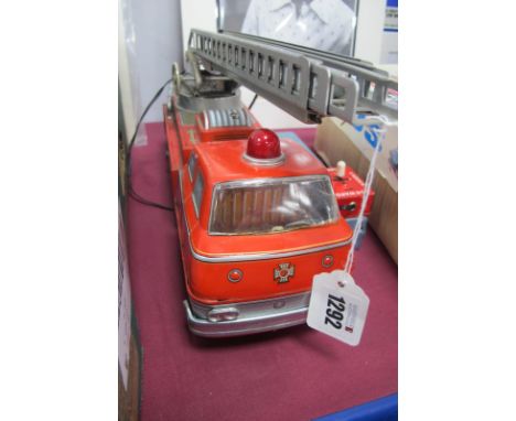 A Tine Plate Japanese Made Fire Engine, TM Trade Mark, remote control F.D No 9, 36cm long.